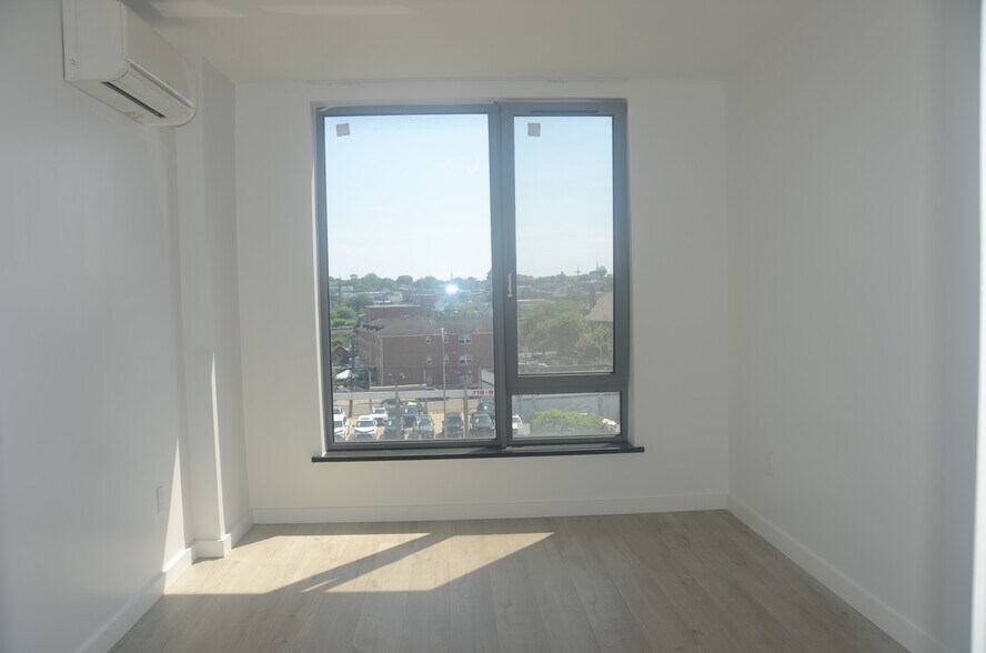Bedroom with a big window - 7065 Queens Blvd