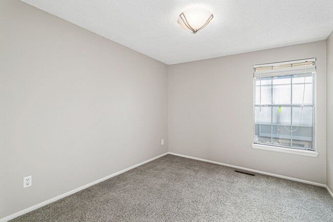 Building Photo - Spacious 4-Bedroom Townhome with Cathedral...