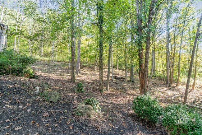 Building Photo - Stunning 4-Bedroom Home with 5 Full Baths + Hot Tub, Wooded Retreat