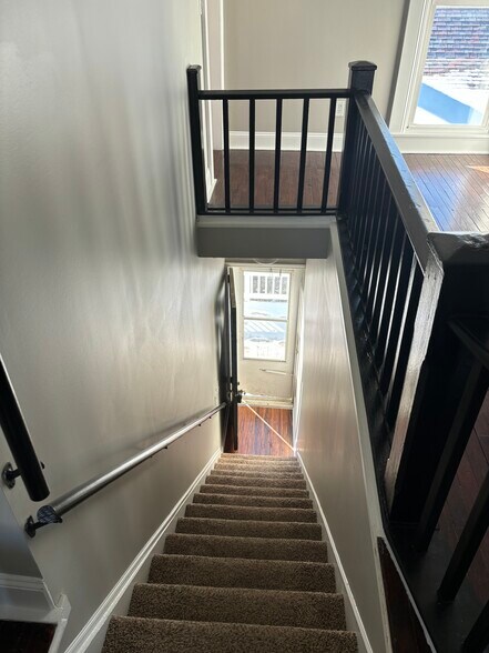 Looking down the stairs to entry door and porch - 1394 Wayne St
