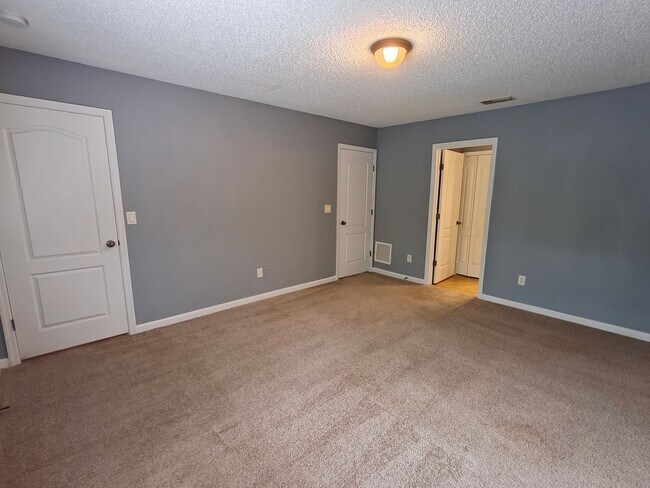 Building Photo - Spacious 2-Bed, 2.5-Bath Townhome with Gar...