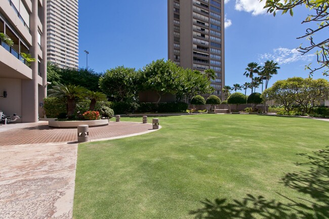 Building Photo - Royal Iolani Corner Unit - 2 PRK w/ ALL Ut...