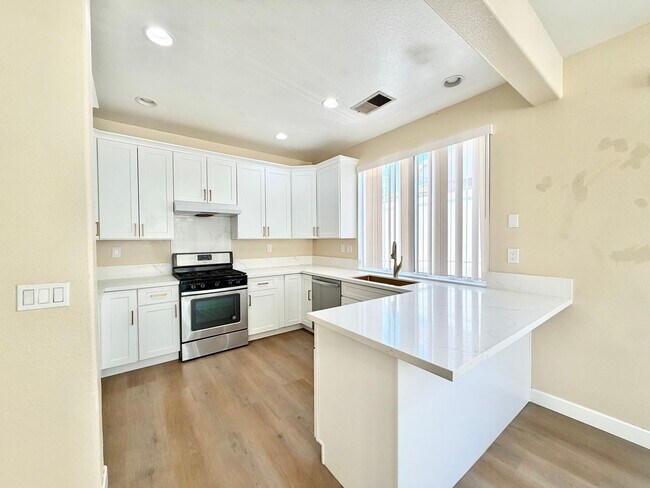 Building Photo - Spacious 5 Bedroom Home with 3 Car Garage & Primary Suite Balcony