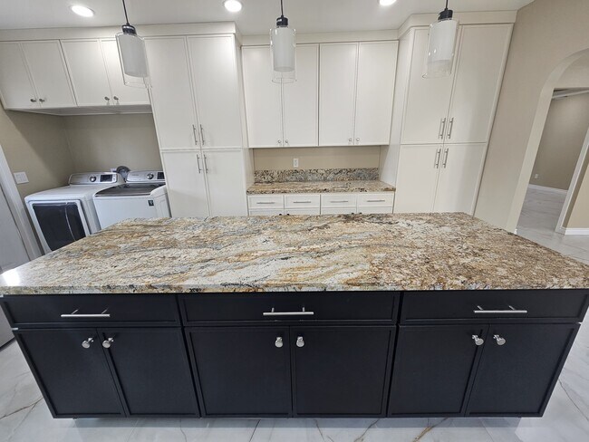 Lots of counter space, washer and dryer, 2 large pantry storage with pull out drawers! - 918 E Elk Ave