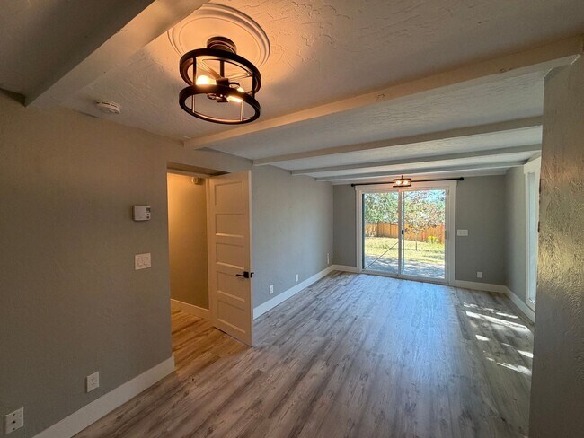 Building Photo - Spacious 4BR/3BA Home with Deck, Fenced Yard & Garage