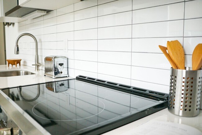 Building Photo - Spring Specials: Sleek & Modern Studio w/Condo-Grade Finishes + Patio!