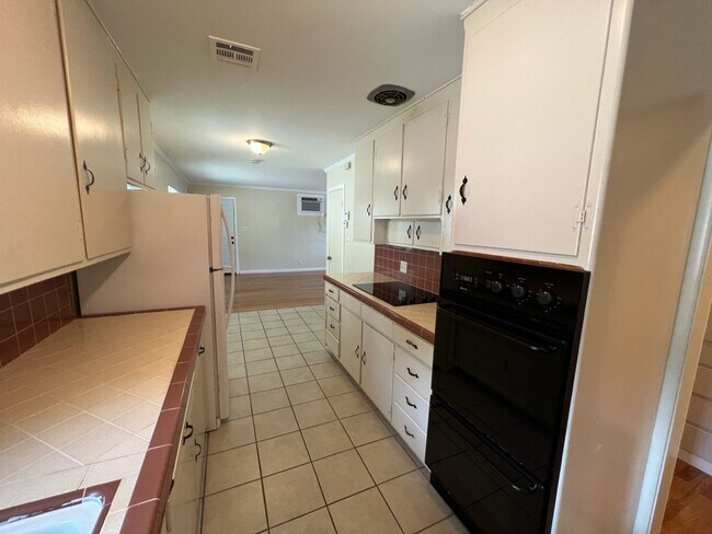 Building Photo - Two-bedroom single story unit with a carport!