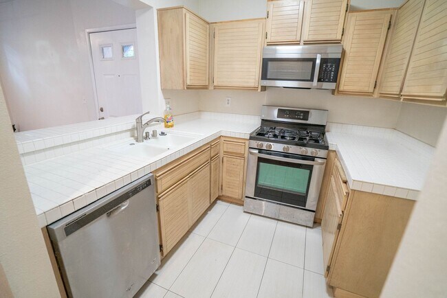 Building Photo - 2-Bedroom Condo with some Utilities Includ...