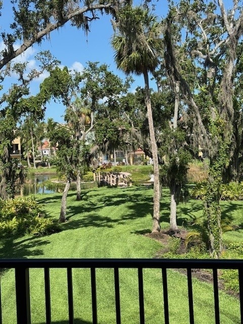 living room deck view of walkway to small pool for the Hammocks. - 1408 3rd Street Cir E