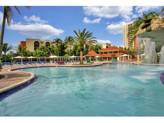 Relax by our Waterfall Swimming Pool - Fontainebleau Milton Apartments