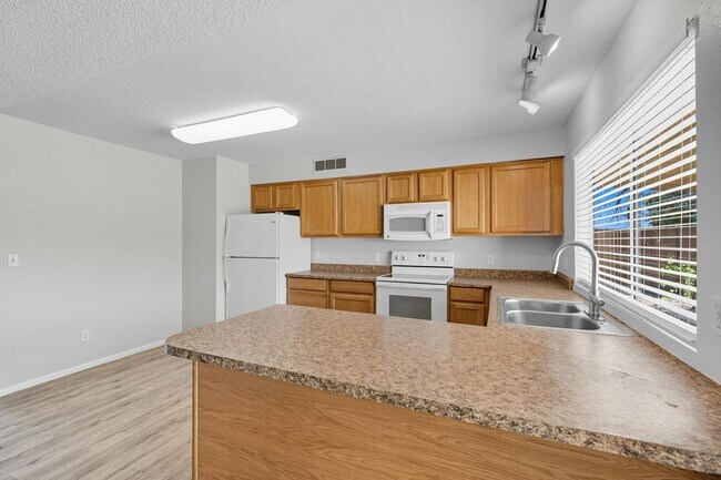 Building Photo - Three bedrooms plus big garage!
