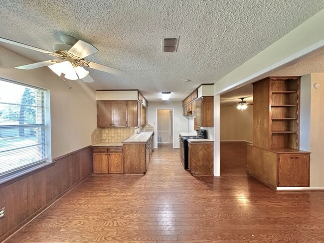 Building Photo - Spacious 4-Bedroom Home on a Corner Lot wi...