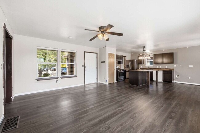 Building Photo - Spacious 5-Bed Retreat with Modern Updates in Aurora. Included - Greenhouse and Shed!