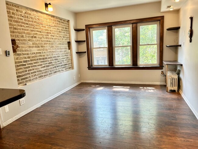 Building Photo - Condo with free heat! In-unit laundry, har...
