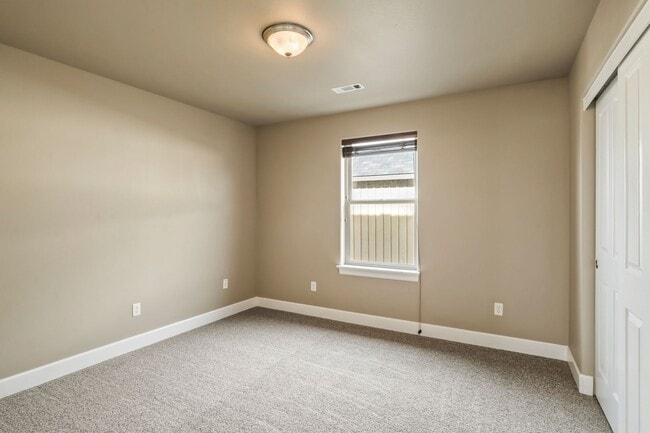 Building Photo - Spacious 4-Bedroom Home with New Paint & Carpet, Fenced Yard