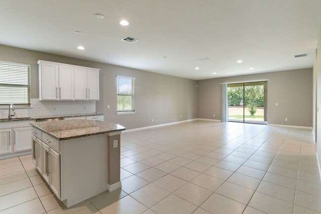 Building Photo - Gorgeous Energy Efficient 4/2 Home in Gated Community Close to Lake Nona
