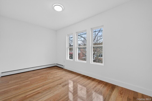 Building Photo - 25-61 99th St