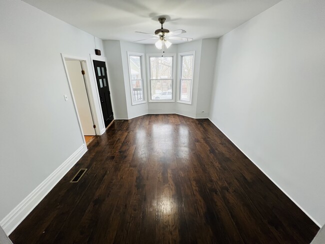 Large windows and high ceiling living room - 4022 N Drake Ave