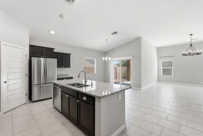 Building Photo - Spacious 3-Bedroom Marana Home with Carpet-Free Flooring & Fenced Yard