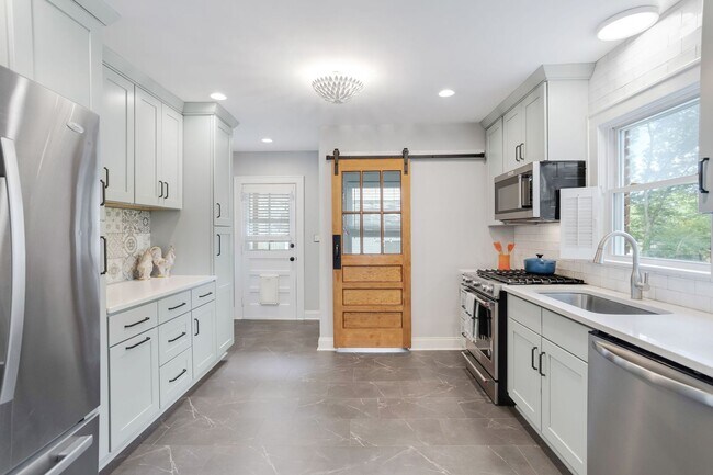 Building Photo - Class Brick Cottage with Modern Comforts in Historic Overbrook