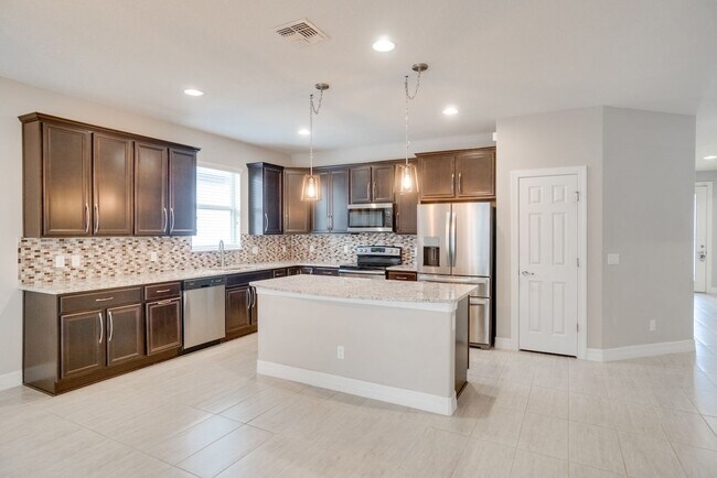 Building Photo - Stunning 3-Bedroom Pool Home with Bonus Room in the Gated Community of Lakeshore at Narcoossee