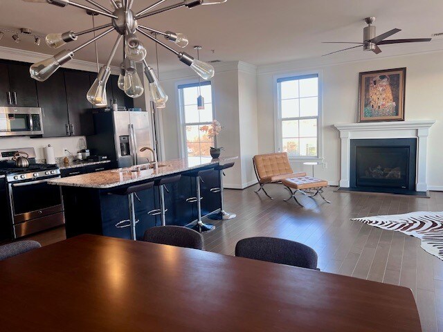 Dining room w/view of additional windows on side of unit - 13722 Neil Armstrong Ave