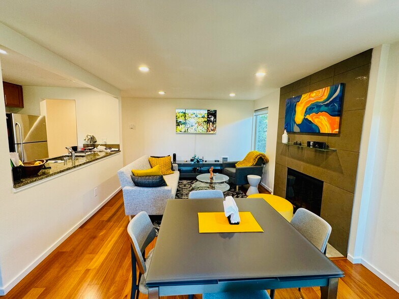 Abundant natural light fills the main living areas, complemented by a versatile layout - 2145 Dexter Ave N