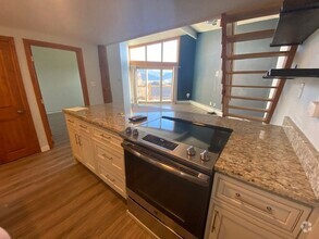 Building Photo - Year Lease 3 bedroom unit with Carport and...