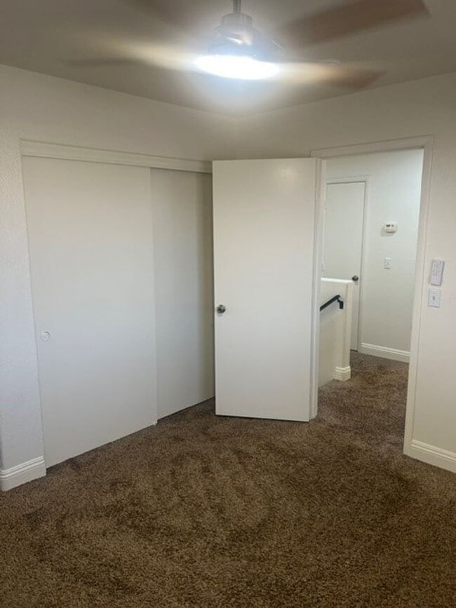 Building Photo - This three bedroom has the primary bedroom on the downstairs level.