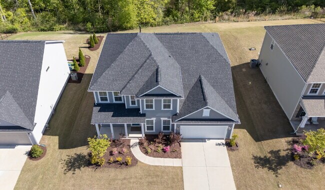 Building Photo - "Discover Spacious Living: 5-Bedroom Craftsman Home in Gated and Amenity-Rich Bretagne with Top-R...