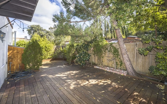 Building Photo - Charming Spanish Style Cottage with Incredible Deck- Gardener's Delight!