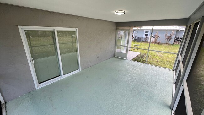 Building Photo - Bright & Spacious 3/2 Home with Huge Yard + Screened Patio — Lawn Care Included!