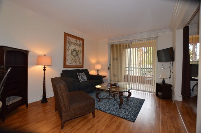 Building Photo - Charming Furnished Studio with Large Patio...