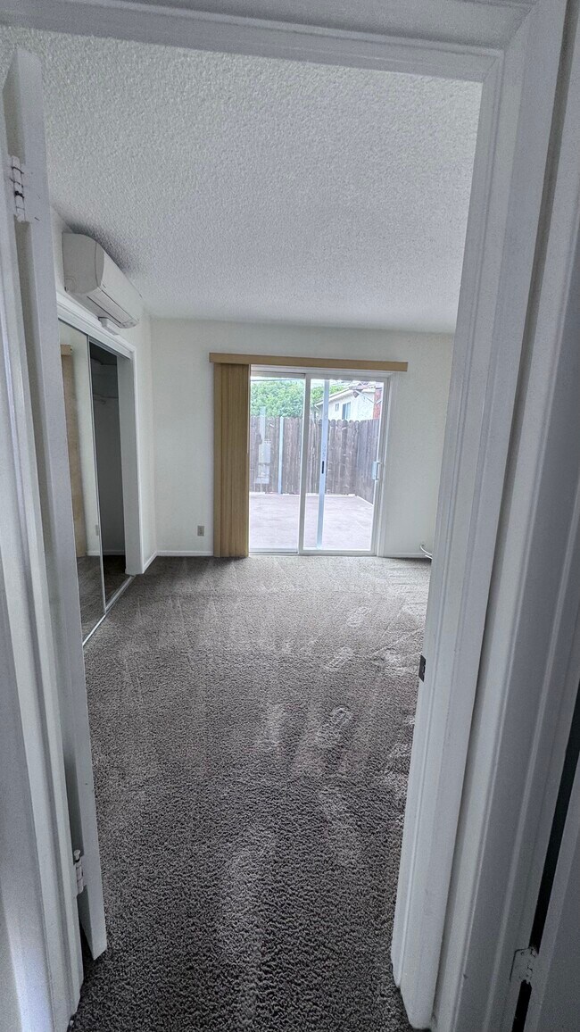 Second bedroom with patio access - 11983 Walnut Ln