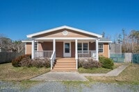 Building Photo - Southport Home With Fences In Yard