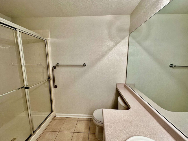 Building Photo - "Spacious 2-Bed, 2-Bath Condo with Pool Ac...