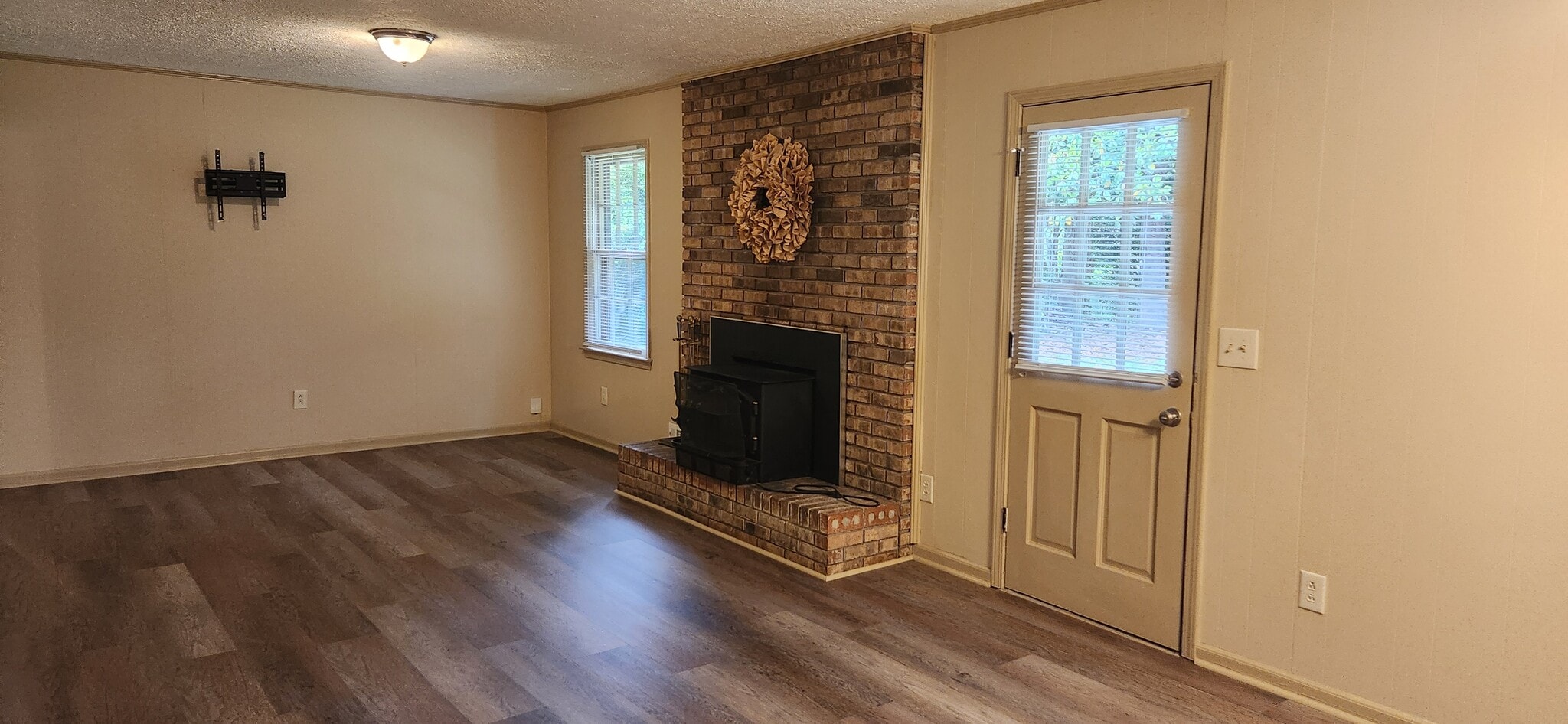 Family room with wood burning stove - 5787 Lorraine Dr