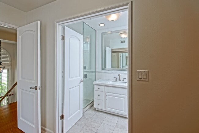 Building Photo - BRIGHT & AIRY, REAR-UNIT TOWNHOUSE W/ SPACIOUS PATIO, BALCONY & HUGE 2-CAR GARAGE IN GATED COMMUN...