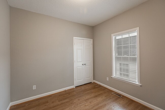 Building Photo - Like New Home off Freeman Mill.  Just Painted, New Wood/Vinyl Flooring, Vaulted Ceilings, Front P...