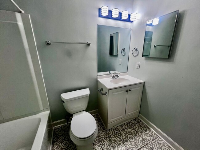 Building Photo - Three-bedroom, two-and-a-half bathrooms in...