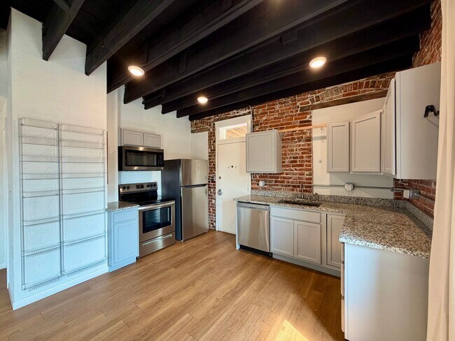 Building Photo - {2202 - A} Spacious Two Bedroom Condo in Historic Pendleton Heights Available Immediately