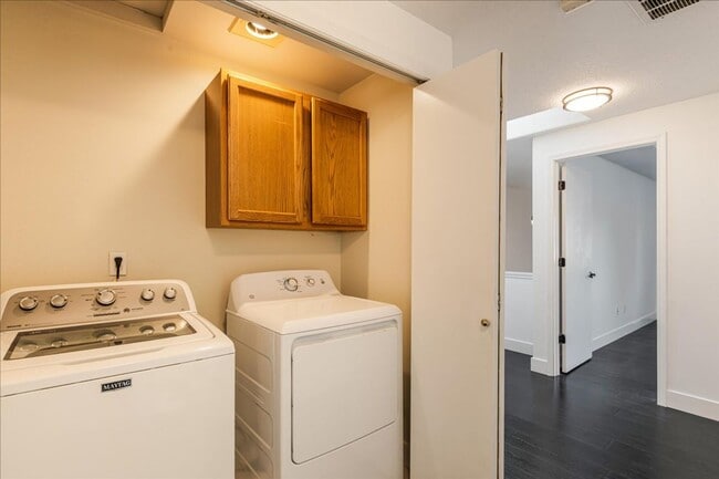 Building Photo - Versatile 4-Bedroom Corner Condo with Main...