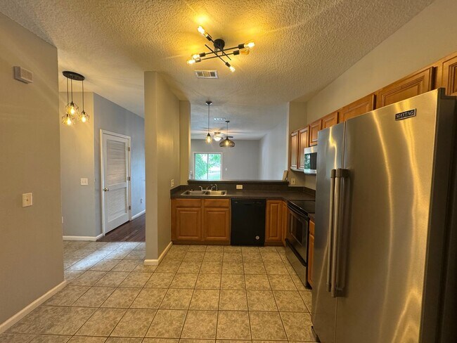 Building Photo - Available Now! Westside Timothy's Landing 2/2.5 Townhome with a 1-Car Garage