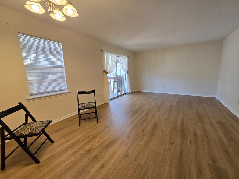 dinning/living rooms with new floors - 2116 Montreat Ln