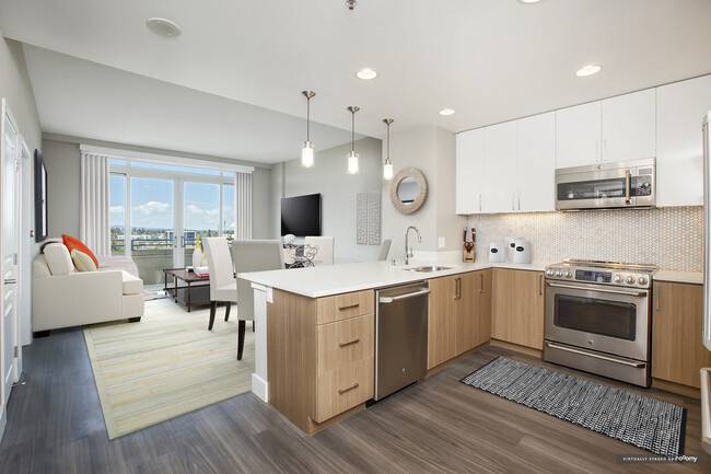 Signature Collection Kitchen Living and Dining Area with Hard Surface Vinyl Plank Flooring - Avalon Towers on the Peninsula