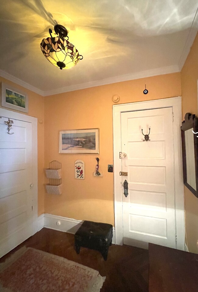 Large Hallway with with closet matching light with Victorian Antique Lamp in the kitchen - 42 Central Ave