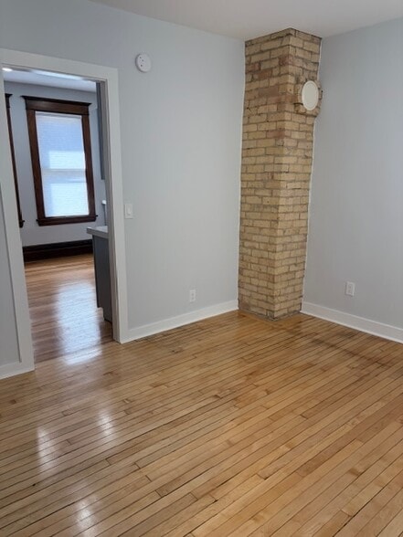 Exposed brick chimney in the master bedroom. - 623 Pierce St NE