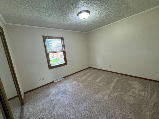 Building Photo - Love Grows — Spacious 2-Story Townhome