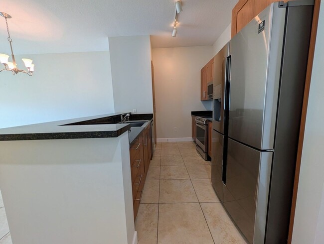 Building Photo - Modern 1BR/1BA Condo with 2 Parking Spaces – Prime Coral Gables Location