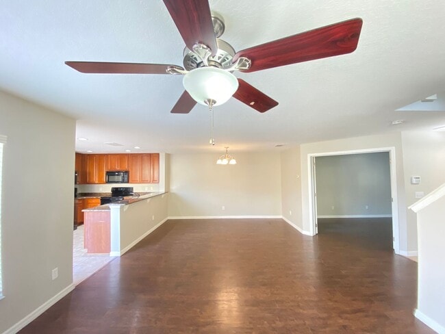 Building Photo - Avalon Park corner end Townhome featuring 3 bedrooms, 2.5 baths, plus office, and 2 car garage.